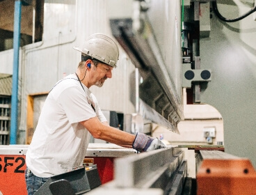Old men working in brake metal image
